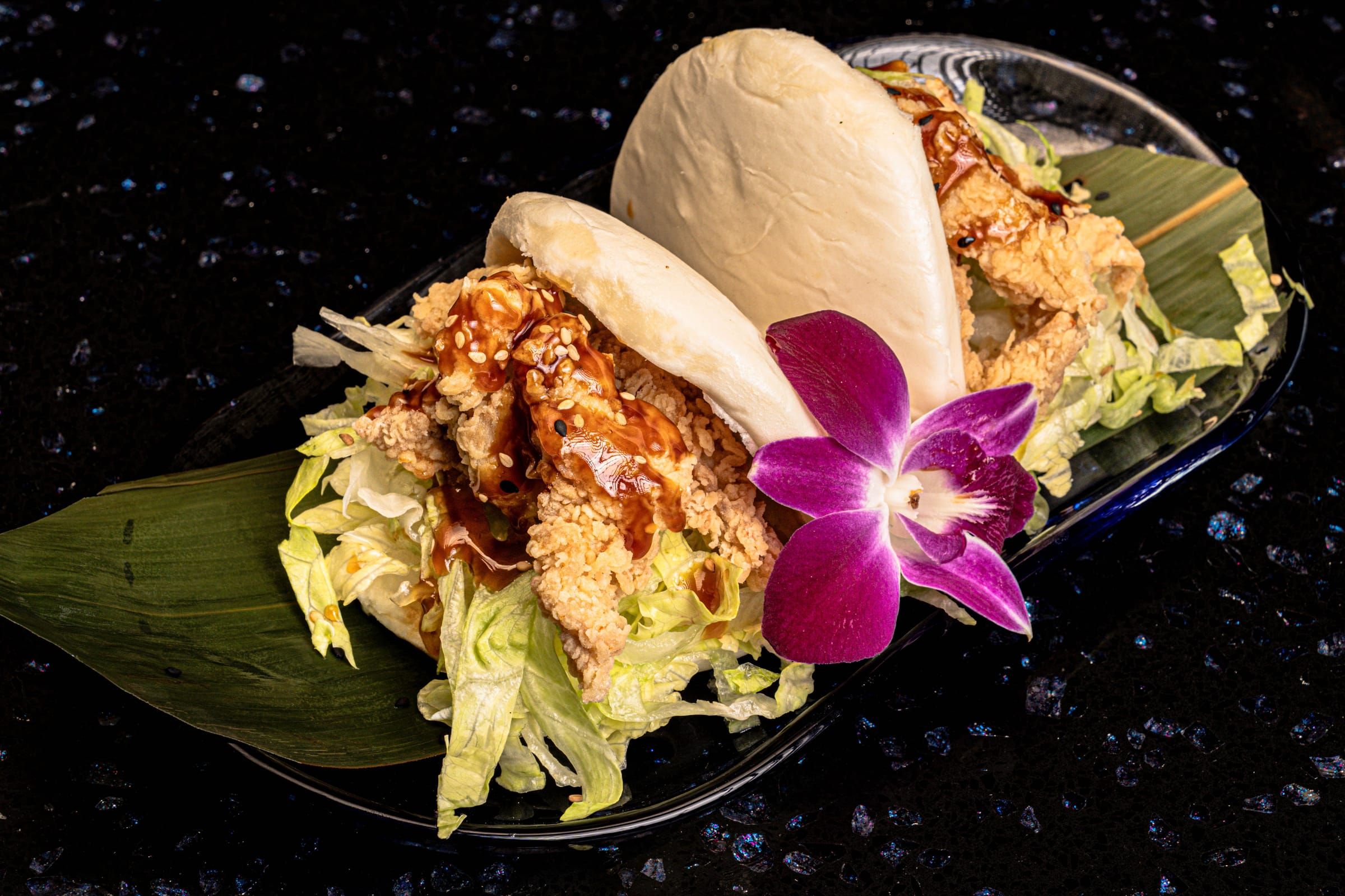 Two stuffed steamed bao buns