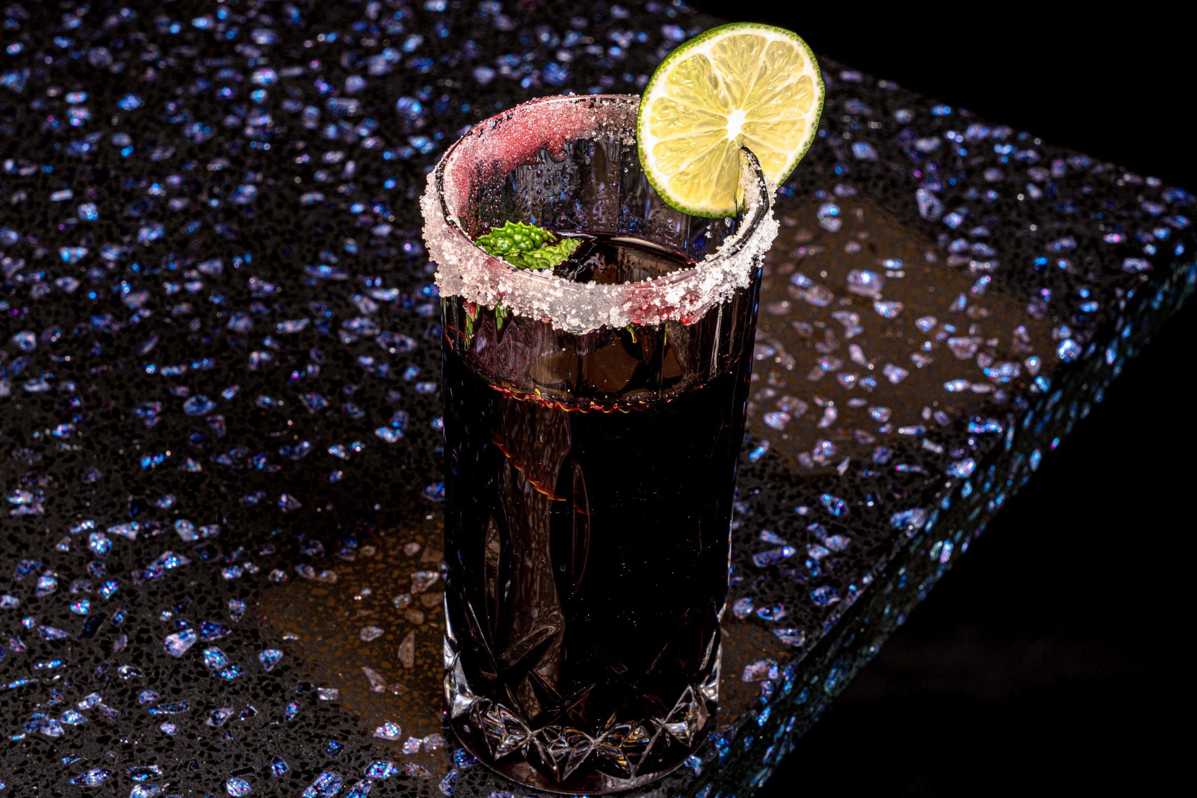 Tall glass of deep purple chicha morada