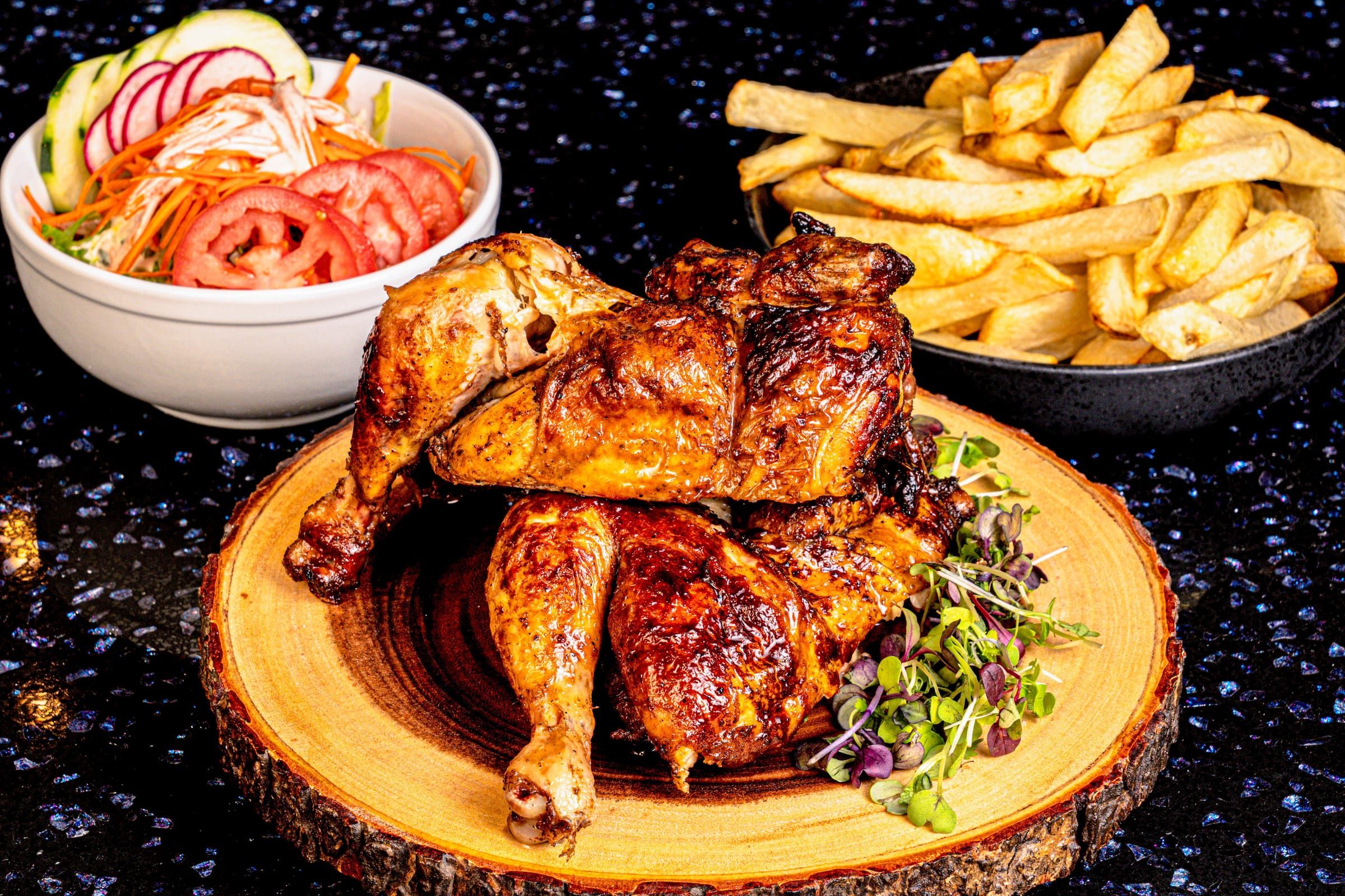 Whole roasted chicken with fries and salad