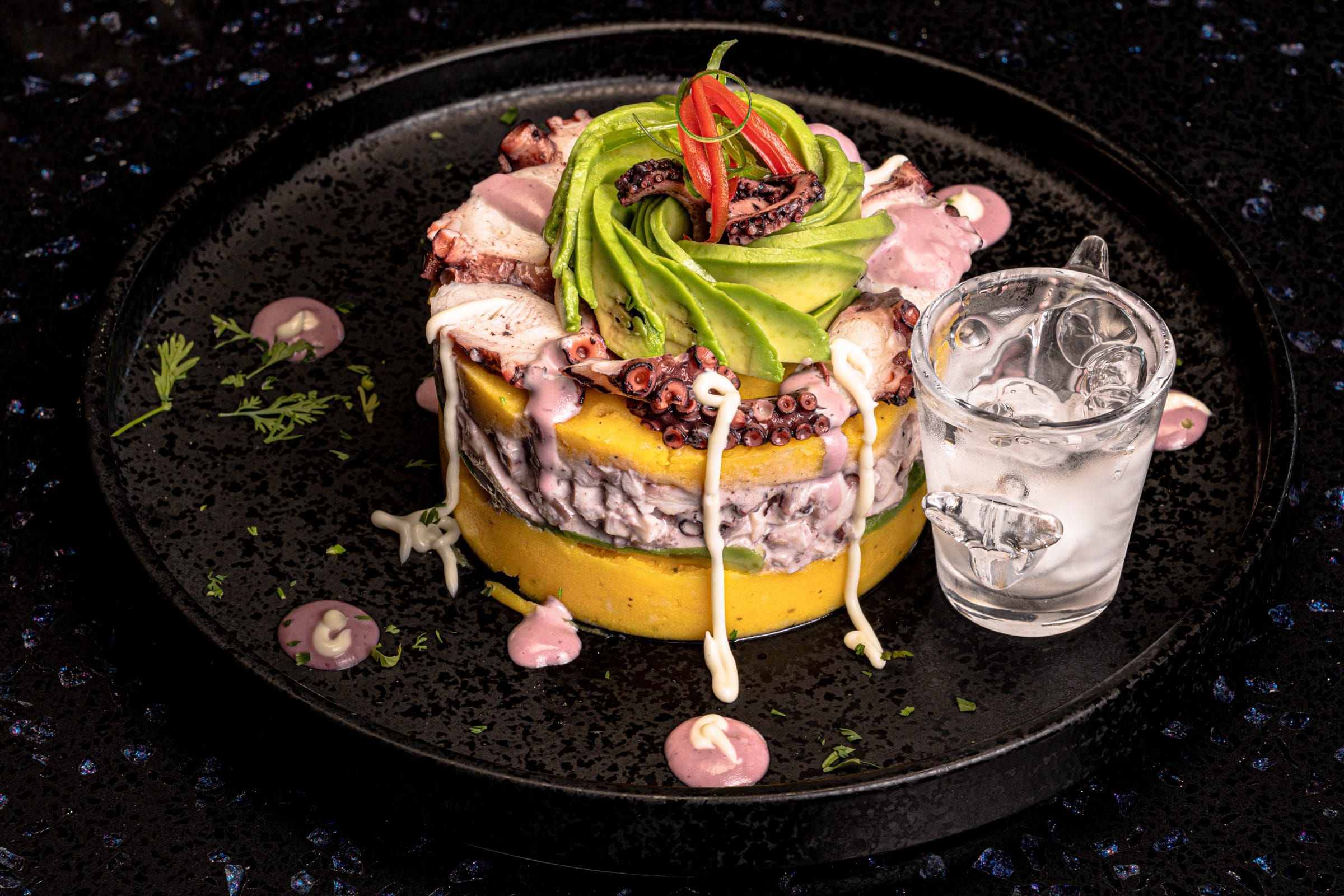 Pulpo al olivo causa with octopus and olive aioli