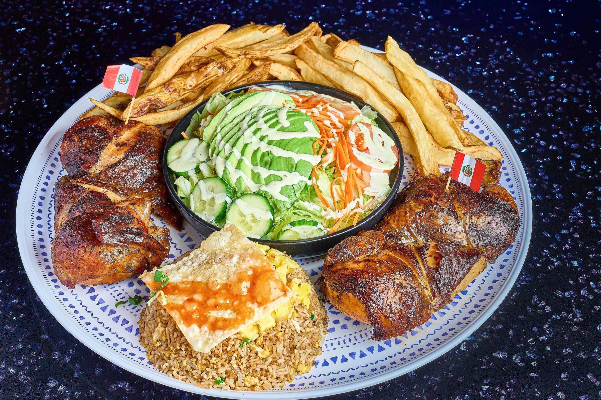 Super Monstro, whole roasted chicken with chaufa, fries, and salad